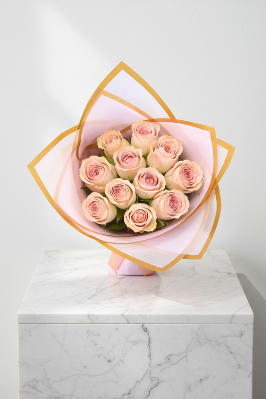 Vibrant 10-stem bunch of variegated pink roses with green leaves, fresh and blooming, arranged in a bouquet style.