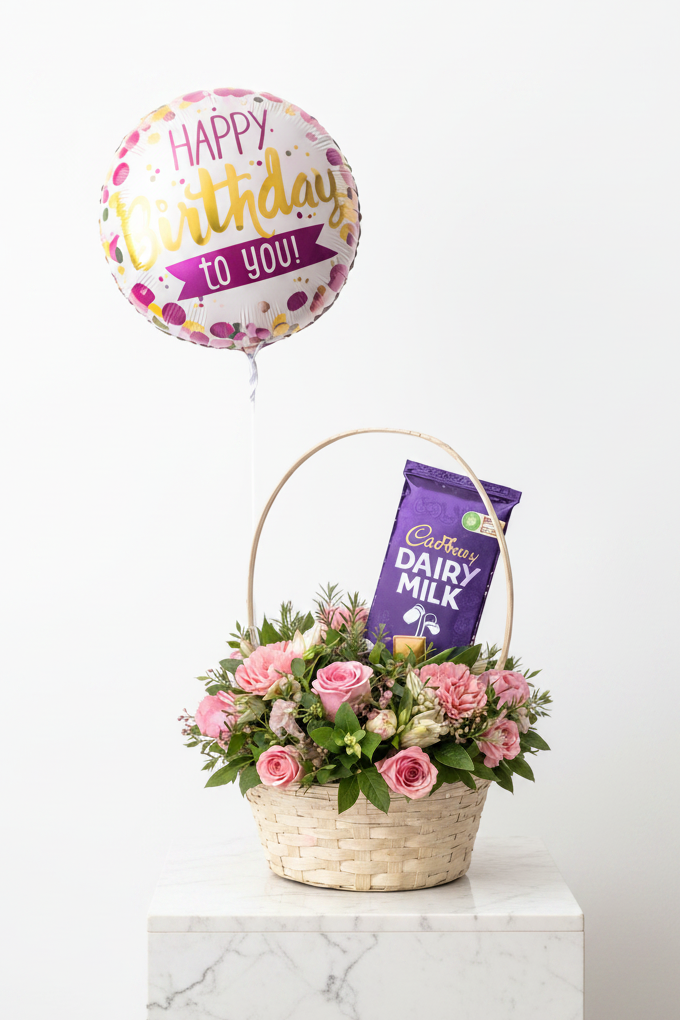 Birthday Bliss Basket gift set from Jihaans Flower Emporium featuring colorful flowers, chocolates, and birthday-themed items.