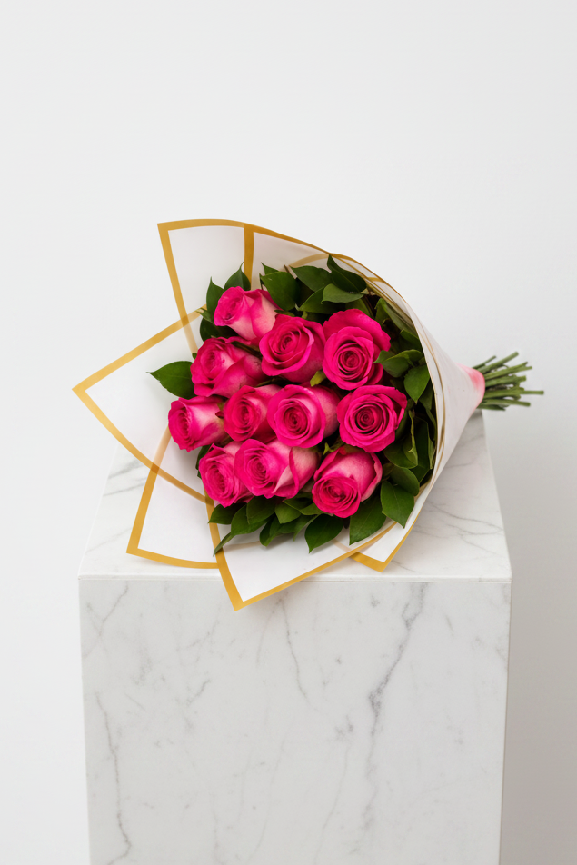 Pink roses arrangement featuring 12 fresh pink roses in a beautiful floral display, perfect for gifting or decoration.