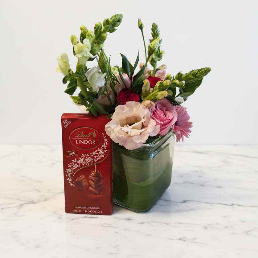 Cupid and Lindt gift set with a vase, featuring chocolates and decorative elements, perfect as an edible gift from My Store.
