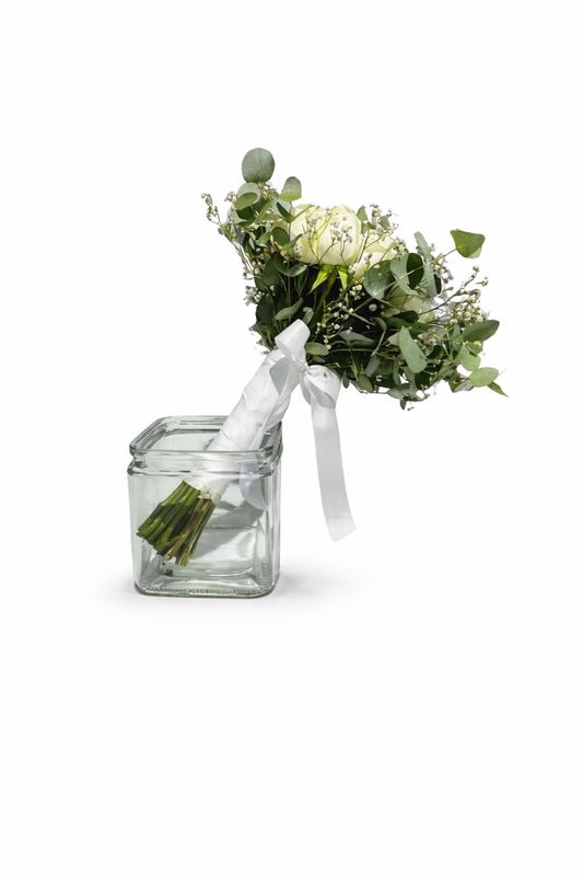 Bridal bouquet featuring roses and PennyGum flowers, arranged with greenery for a wedding or special occasion.