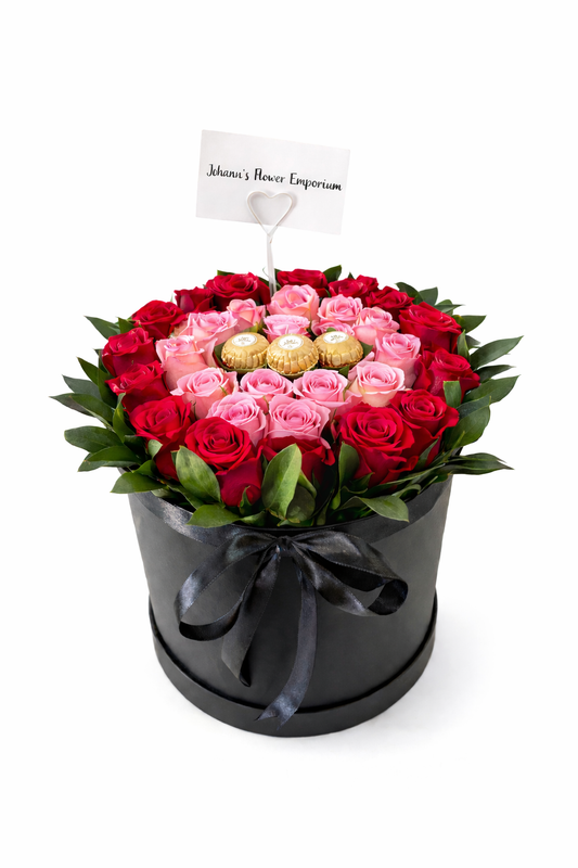 Black and pink floral bucket hat with wide brim, featuring vibrant flower patterns and casual style.