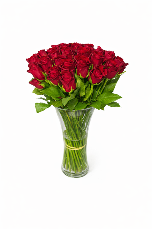 50 red roses with long stems arranged in a clear glass vase, perfect for romantic occasions.