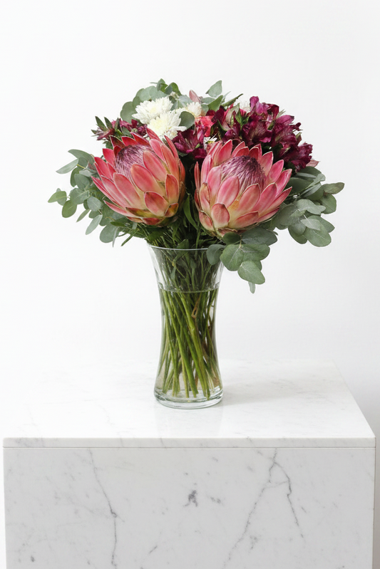 Elegant glass vase with fresh pink and white flowers from the Perfect Impression Bloom collection by My Store.