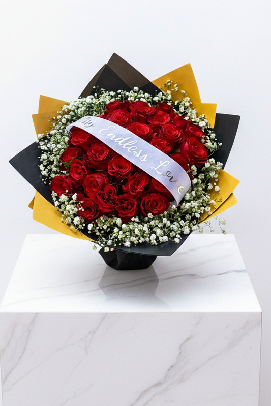 30 stem roses with baby's breath and personalized ribbon from Jihaans Flower Emporium, arranged in a bouquet.