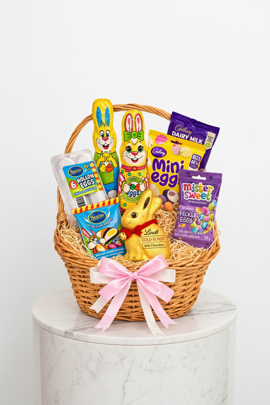 Easter sweet treat basket from Jihaans Flower Emporium with colorful candies and chocolates in a festive edible gift arrangement.