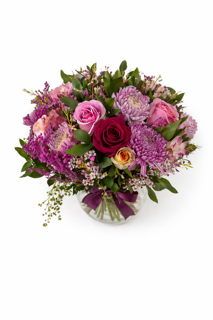 Large floral arrangement with blush blooms in a clear glass vase, arranged in a stylish vase from My Store.