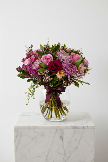 Large Blush Bloom floral arrangement in a decorative vase, featuring pink and white blooms in a stylish vase.