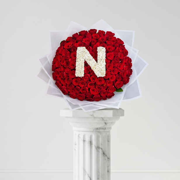 Bouquet of 100 colorful roses from My Store with a personalized letter, arranged in a lush, vibrant display.