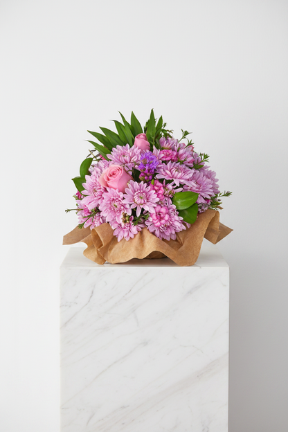 A bouquet of colorful flowers with petals and greenery, arranged in a delicate "A Touch of Love and Petals" Posie by My Store.