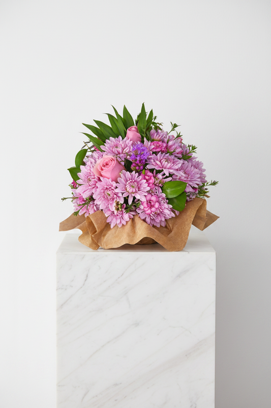 A bouquet of colorful flowers with petals and greenery, arranged in a delicate "A Touch of Love and Petals" Posie by My Store.